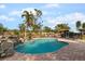 Outdoor pool featuring a stone waterfall feature and ample patio space at 4301 S Lockwood Ridge Rd, Sarasota, FL 34231