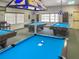 Bright billiard room with multiple tables, providing a great space for recreation and socializing at 4550 Cove Cir # 1003, St Petersburg, FL 33708