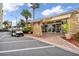 Elegant building entrance featuring stone accents, brick walkway, and convenient golf cart parking at 4550 Cove Cir # 1003, St Petersburg, FL 33708