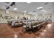 Spacious event room ready for gatherings, featuring ample seating and natural light at 4550 Cove Cir # 1003, St Petersburg, FL 33708
