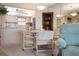 Cozy dining area with neutral tones adjacent to the kitchen at 4550 Cove Cir # 1003, St Petersburg, FL 33708