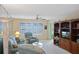 Inviting living room with plush seating, a ceiling fan, and large windows at 4550 Cove Cir # 1003, St Petersburg, FL 33708