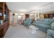 Spacious and comfortable living room connected to the kitchen and dining area at 4550 Cove Cir # 1003, St Petersburg, FL 33708