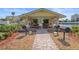 Outdoor pavilion with charcoal grills and picnic tables overlooking waterfront views at 4550 Cove Cir # 1003, St Petersburg, FL 33708