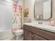 Bathroom featuring a shower-tub combo, vanity, and modern fixtures at 4620 Ballast Crest Cv, Land O Lakes, FL 34638