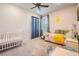 Bright bedroom featuring carpet floors, ceiling fan, natural light, and -friendly decor at 4620 Ballast Crest Cv, Land O Lakes, FL 34638