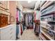 Organized walk-in closet with custom shelving and ample storage space for clothes and accessories at 4620 Ballast Crest Cv, Land O Lakes, FL 34638