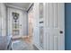Bright foyer with decorative glass front door and decorative sliding barn door at 4620 Ballast Crest Cv, Land O Lakes, FL 34638
