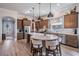 Gourmet kitchen with a large island, stainless steel appliances, and wooden cabinets at 4620 Ballast Crest Cv, Land O Lakes, FL 34638