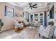Bright living room featuring hardwood floors, recessed lighting, modern furnishings, and neutral wall colors at 4620 Ballast Crest Cv, Land O Lakes, FL 34638