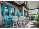 Stylish screened patio with an outdoor bar and comfortable seating at 4620 Ballast Crest Cv, Land O Lakes, FL 34638