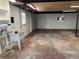 Unfinished basement with utility sink and access door at 5008 N Suwanee Ave, Tampa, FL 33603