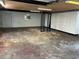 Unfinished basement with storage cabinets and access door at 5008 N Suwanee Ave, Tampa, FL 33603