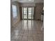 Dining room area featuring tile flooring and french doors that lead to the patio at 5008 N Suwanee Ave, Tampa, FL 33603