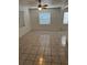 Bright living room featuring tile flooring, natural light and a ceiling fan at 5008 N Suwanee Ave, Tampa, FL 33603