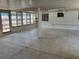 Enclosed back porch, or sun room, with tile floor and white walls at 5008 N Suwanee Ave, Tampa, FL 33603