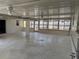 Enclosed back porch, or sun room, with tile floor and a view to the back yard at 5008 N Suwanee Ave, Tampa, FL 33603