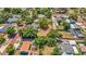 The house with a spacious yard and beautiful trees is showcased from above at 504 7Th Sw Ave, Largo, FL 33770