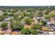 Captured from above is a home on a tree-lined street with a very spacious yard for various outdoor activities at 504 7Th Sw Ave, Largo, FL 33770