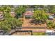 An aerial view shows this home features a large, fenced yard and mature trees offering plenty of shade at 504 7Th Sw Ave, Largo, FL 33770