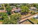 This aerial photo displays the home and a large, fenced yard perfect for outdoor activities and relaxation at 504 7Th Sw Ave, Largo, FL 33770
