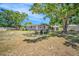 Picturesque backyard featuring mature trees, patio seating, and space for outdoor enjoyment and relaxation at 504 7Th Sw Ave, Largo, FL 33770