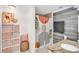 Bright bathroom with a stone countertop vanity, patterned shower curtain, and stylish decor at 504 7Th Sw Ave, Largo, FL 33770