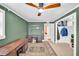 Stylish room showcases a desk, and a closet with an organized storage system and hanging clothes at 504 7Th Sw Ave, Largo, FL 33770