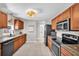 Modern kitchen with stainless steel appliances, ample cabinetry, and a view into the dining area at 504 7Th Sw Ave, Largo, FL 33770
