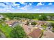 Property featuring a cozy, two-story home, a neatly maintained backyard, and a serene pond view at 5525 Turtle Crossing Loop, Tampa, FL 33625