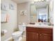 Bathroom featuring a single sink vanity, wall art and laminate floors at 5525 Turtle Crossing Loop, Tampa, FL 33625