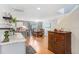 Open layout featuring hardwood flooring, a dining area, and a view into the kitchen at 5525 Turtle Crossing Loop, Tampa, FL 33625