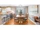 Dining Room area with hardwood floors adjacent to the kitchen bar top at 5525 Turtle Crossing Loop, Tampa, FL 33625