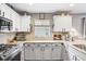 Well-maintained kitchen featuring stainless appliances, lighter countertops and tile backsplash at 5525 Turtle Crossing Loop, Tampa, FL 33625