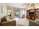 Comfortable living room with vaulted ceilings, plush furnishings, hardwood floors and sliding door access at 5525 Turtle Crossing Loop, Tampa, FL 33625