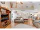 Spacious living room with vaulted ceilings, hardwood floors and open floor plan adjacent to the kitchen at 5525 Turtle Crossing Loop, Tampa, FL 33625