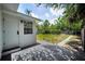 Backyard patio offers a tranquil view of the landscaped yard, featuring a privacy fence and green space at 5642 9Th N Ave, St Petersburg, FL 33710