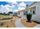 Inviting single-story home with a beautifully landscaped front yard and welcoming walkway at 5642 9Th N Ave, St Petersburg, FL 33710
