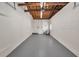 Spacious garage featuring a painted floor, exposed rafters and ample room for storage and parking at 5642 9Th N Ave, St Petersburg, FL 33710