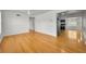 Bright living room featuring shiny hardwood floors, white walls, and an open layout at 5642 9Th N Ave, St Petersburg, FL 33710