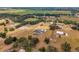 Sprawling property featuring a beautiful home with pool, solar panels, circular drive, and a picturesque landscape at 602 Swilley Rd, Plant City, FL 33567