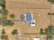 Breathtaking aerial view of a home, set on sprawling acreage with a pool, garage, and circular drive at 602 Swilley Rd, Plant City, FL 33567