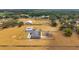 Expansive aerial view showcasing a home, pool, detached garage, and well-maintained grounds, highlighting the property's features at 602 Swilley Rd, Plant City, FL 33567