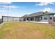 Backyard featuring a pool, patio, and an outbuilding at 602 Swilley Rd, Plant City, FL 33567