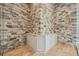 Unique bar area with stone wall accent and custom cabinetry for storage and display at 602 Swilley Rd, Plant City, FL 33567