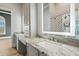 Bathroom featuring granite countertops, custom cabinets, and modern decor at 602 Swilley Rd, Plant City, FL 33567
