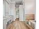 Elegant bathroom featuring walk-in shower, soaking tub, and custom cabinets at 602 Swilley Rd, Plant City, FL 33567