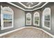 Spacious bedroom features wood floors, large windows, and tray ceiling at 602 Swilley Rd, Plant City, FL 33567