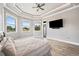 Well-lit bedroom with wood-look floors, many windows, and neutral walls, perfect for relaxation at 602 Swilley Rd, Plant City, FL 33567