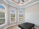 Bedroom with tray ceiling and ample natural light at 602 Swilley Rd, Plant City, FL 33567